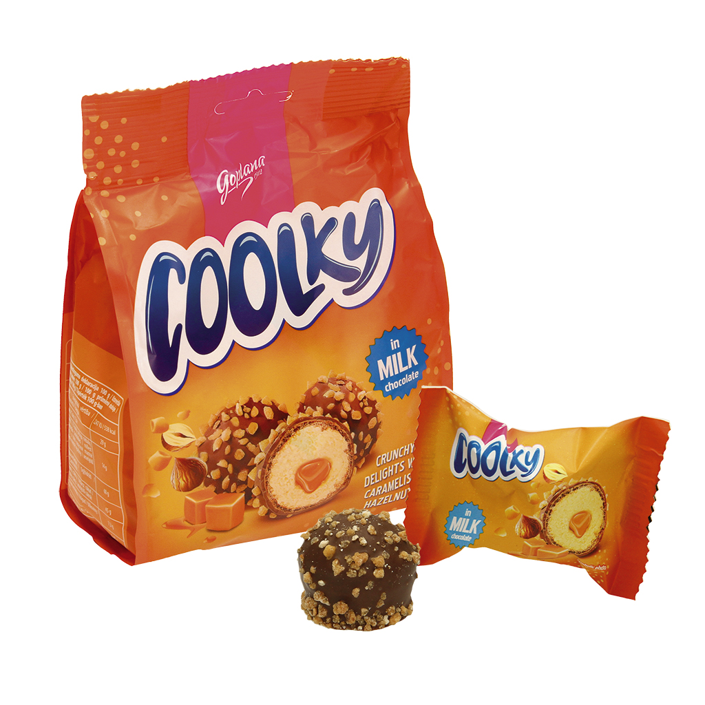 "Coolky Milk" Вафельные шарики с кремом со вкусом бисквита (48%) и карамельной начинкой (8,7%) в молочном шоколаде (25%) и сахарно-фундуковой посыпке (10%).